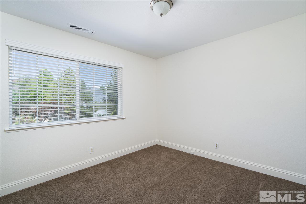 6284 Sunrise Meadows Loop Reno, NV 89519 - Photo 17 of 18 an empty room with a window