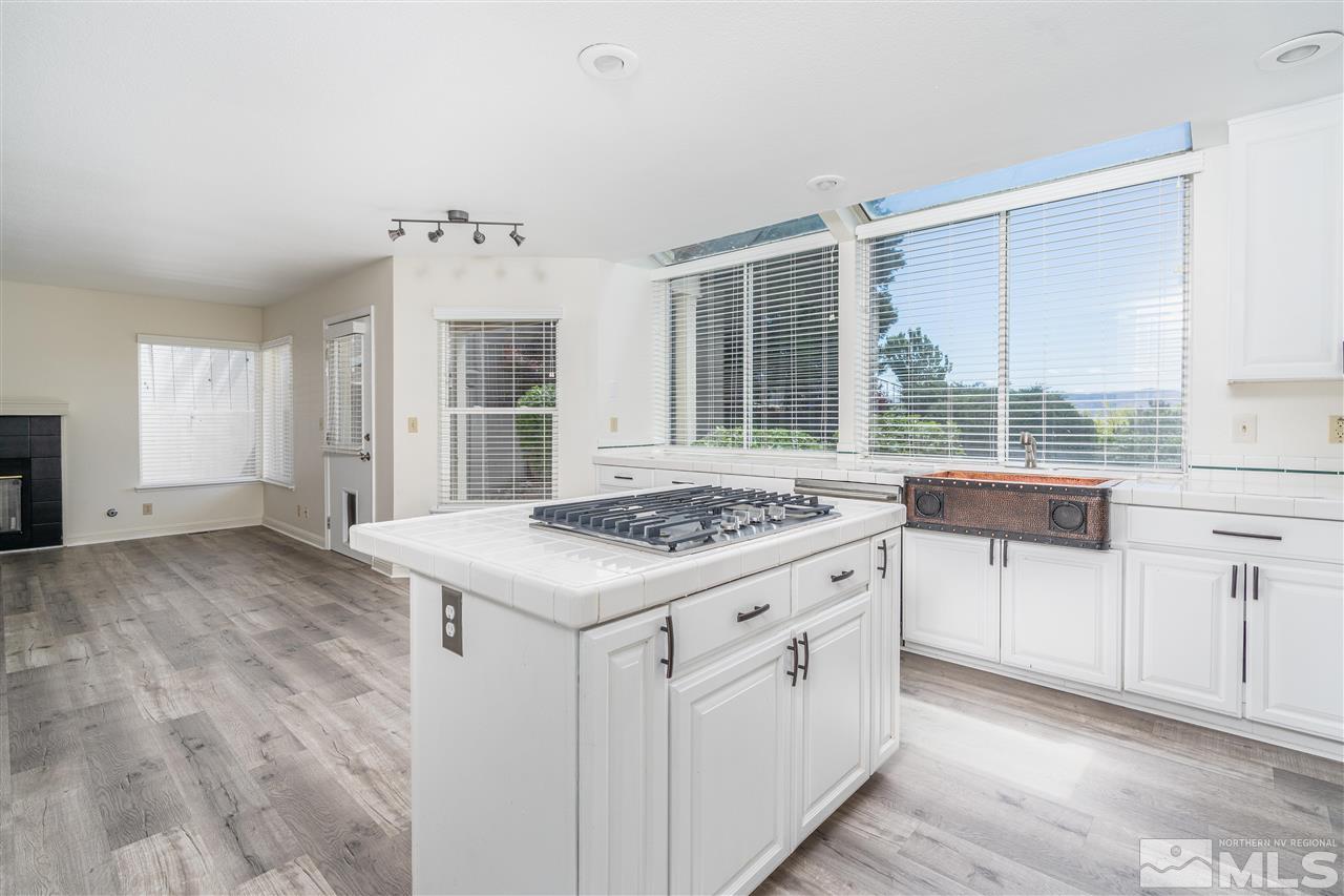 6284 Sunrise Meadows Loop Reno, NV 89519 - Photo 8 of 18 a kitchen that has a stove and a table in it