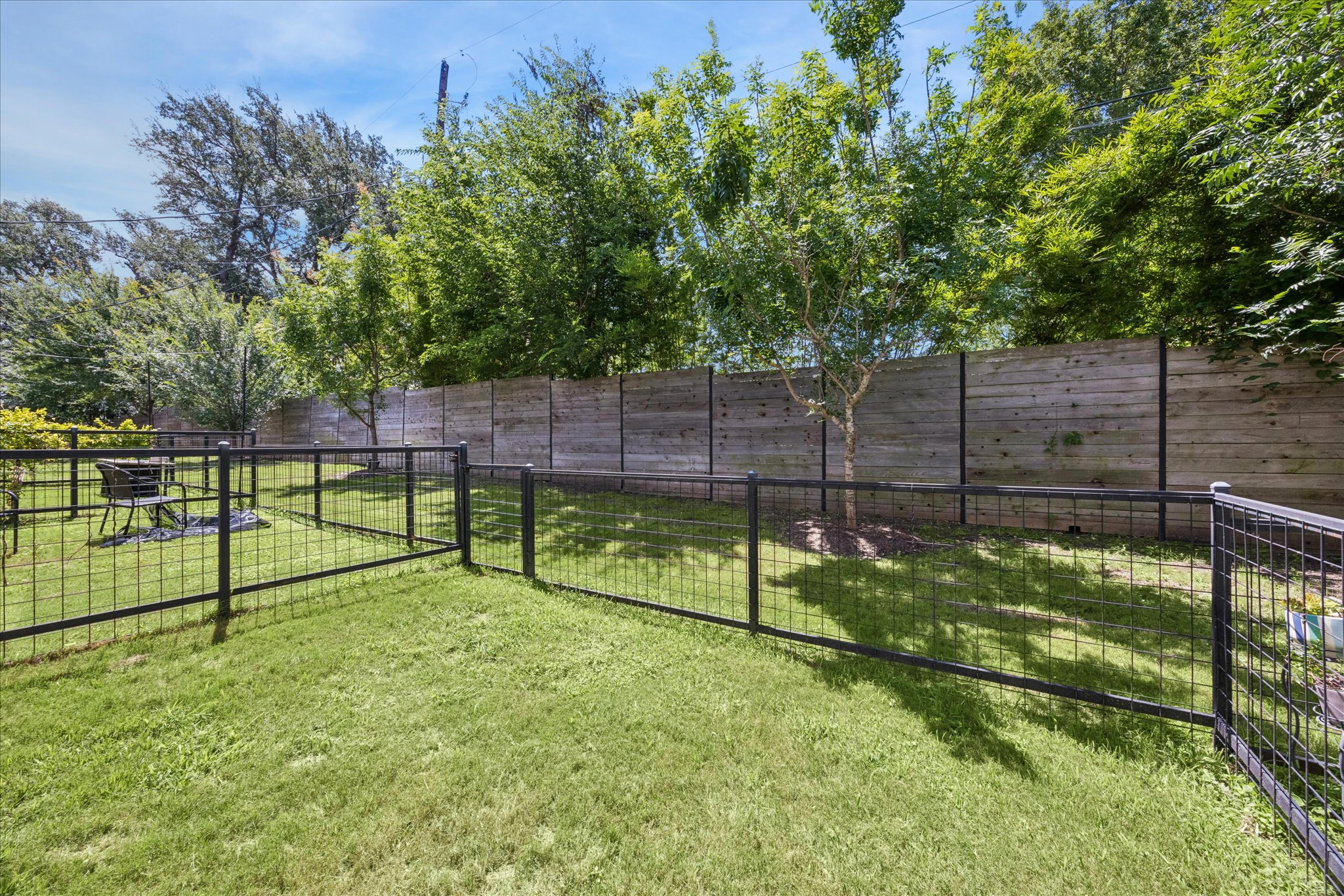 2108 Tillery Street, Unit 9 Austin, TX 78723 - Photo 22 of 25 HOA-maintained fenced yard