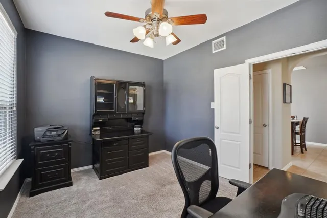 a workspace with furniture and wooden floor
