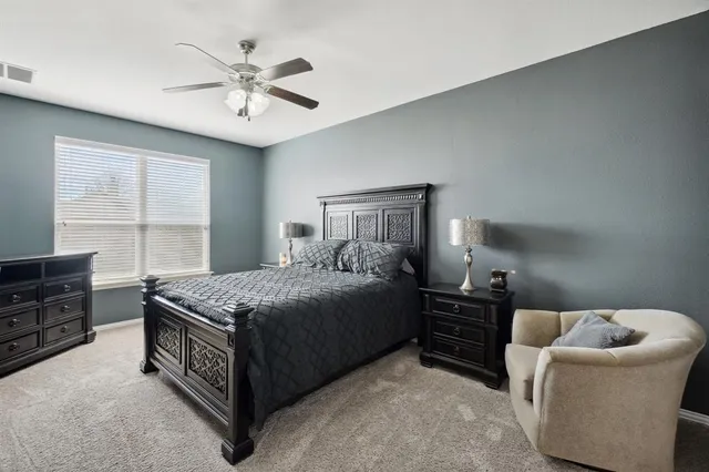 a bedroom with a bed and window