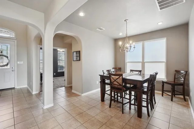a kitchen with stainless steel appliances granite countertop a sink stove and microwave