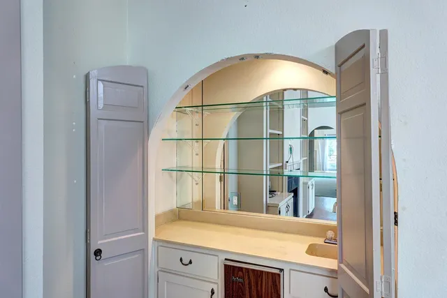 a view of a bathroom with a sink and window