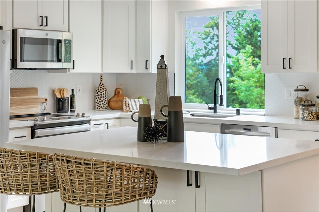 2807 Mill Avenue South Renton, WA 98055 - Photo 12 of 34 a kitchen with a sink a counter and cabinets