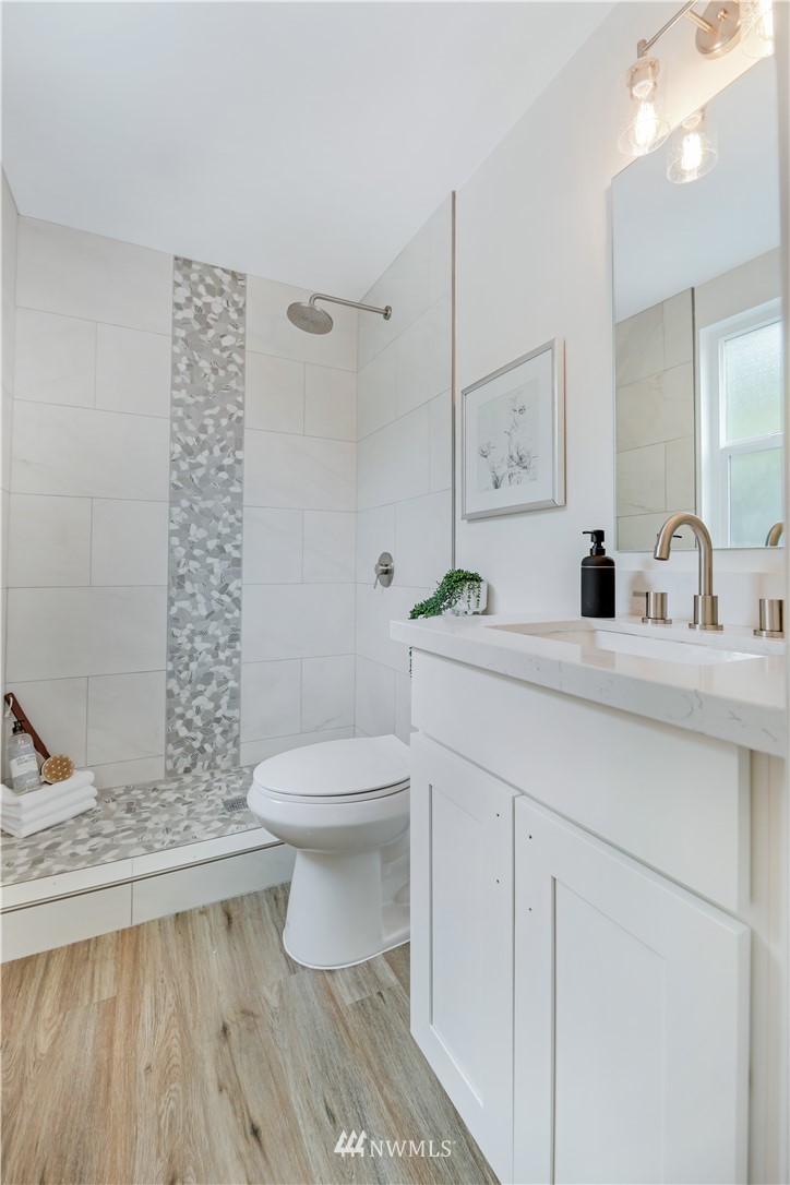 2807 Mill Avenue South Renton, WA 98055 - Photo 21 of 34 a bathroom with a sink a toilet and shower