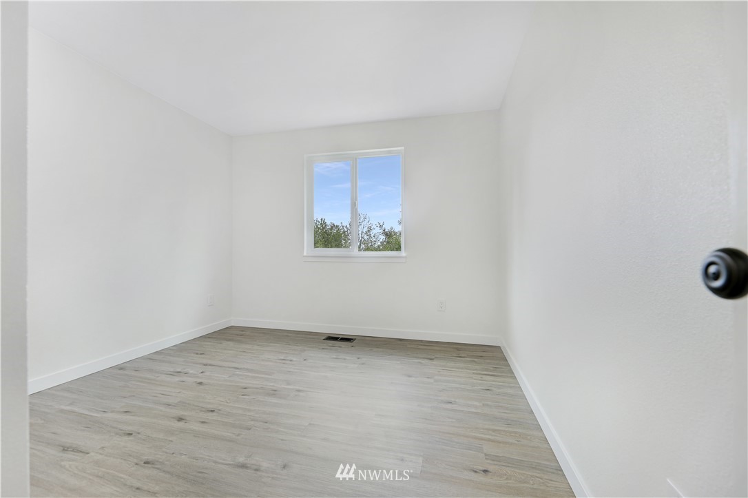 2807 Mill Avenue South Renton, WA 98055 - Photo 22 of 34 a view of an empty room with wooden floor