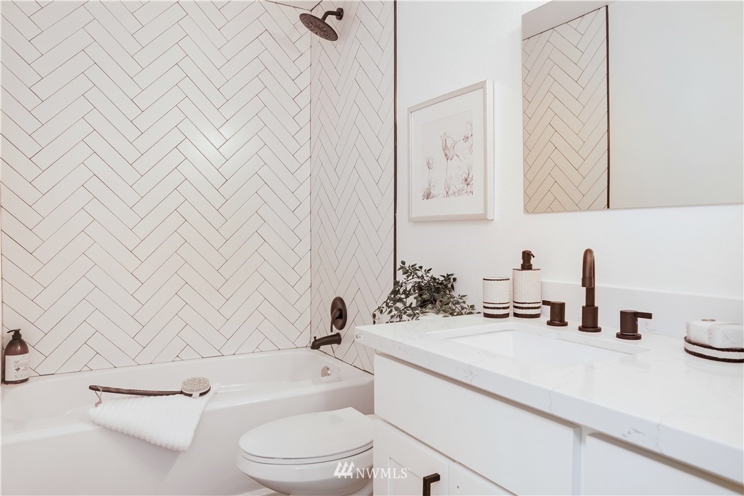 2807 Mill Avenue South Renton, WA 98055 - Photo 23 of 34 a bathroom with a sink a toilet and a mirror