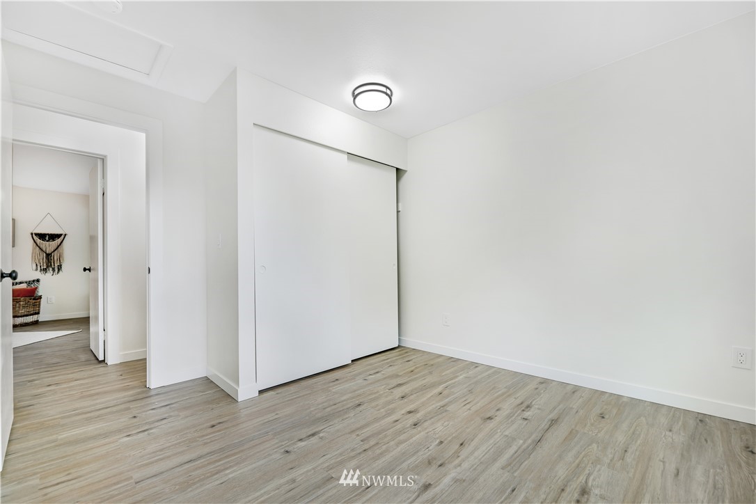 2807 Mill Avenue South Renton, WA 98055 - Photo 24 of 34 an empty room with wooden floor and closet