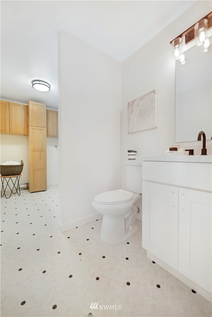 2807 Mill Avenue South Renton, WA 98055 - Photo 25 of 34 a bathroom with a sink a toilet and mirror