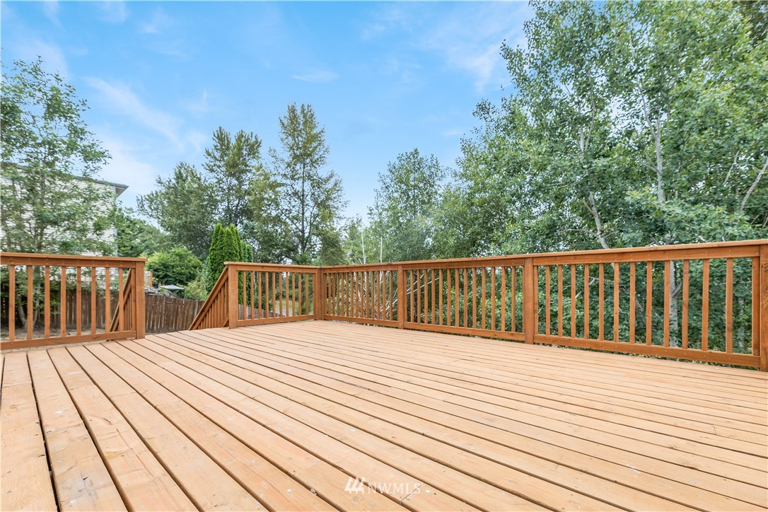 2807 Mill Avenue South Renton, WA 98055 - Photo 31 of 34 a view of deck with wooden floor and fence and trees