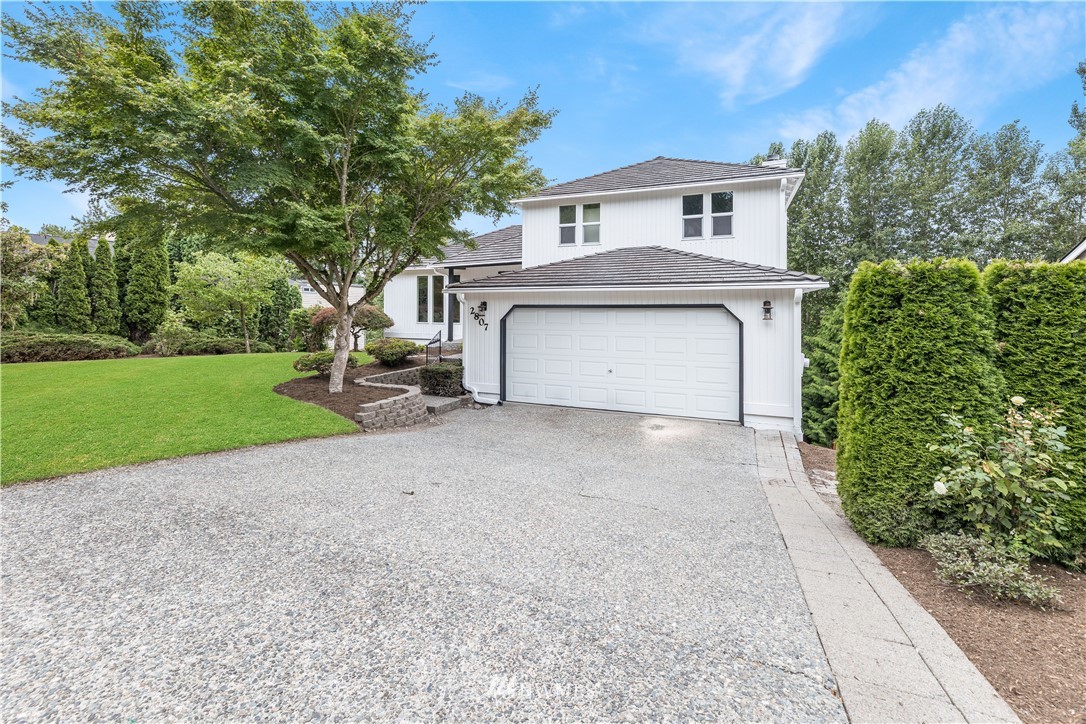 2807 Mill Avenue South Renton, WA 98055 - Photo 34 of 34 a front view of a house with a garden and trees