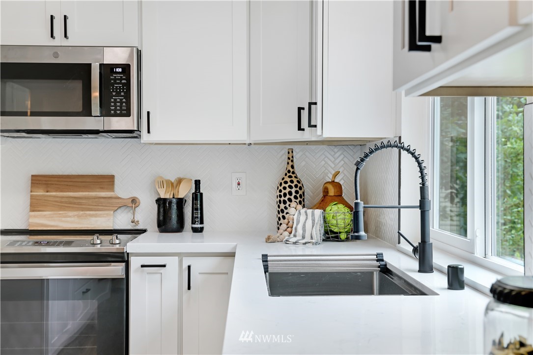 2807 Mill Avenue South Renton, WA 98055 - Photo 9 of 34 a kitchen with stainless steel appliances granite countertop a sink and a microwave