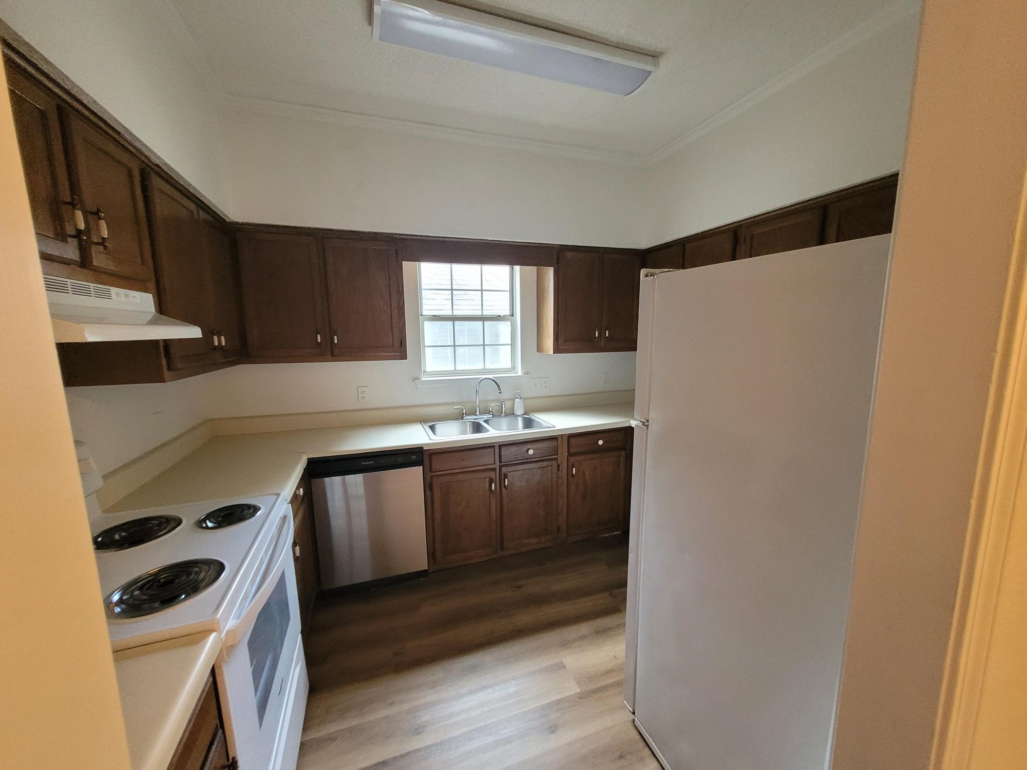 10039 Foxrun Road Pensacola, FL 32514 - Photo 6 of 9 a kitchen with a white stove top oven and sink