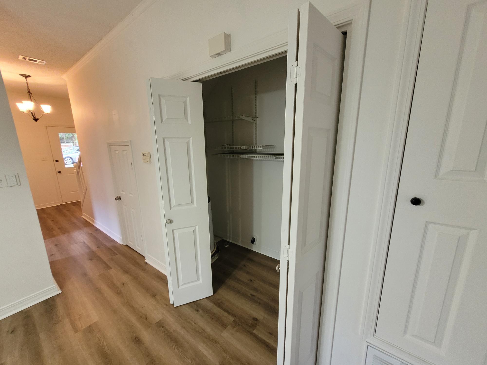 10039 Foxrun Road Pensacola, FL 32514 - Photo 8 of 9 a view of a hallway with wooden floor