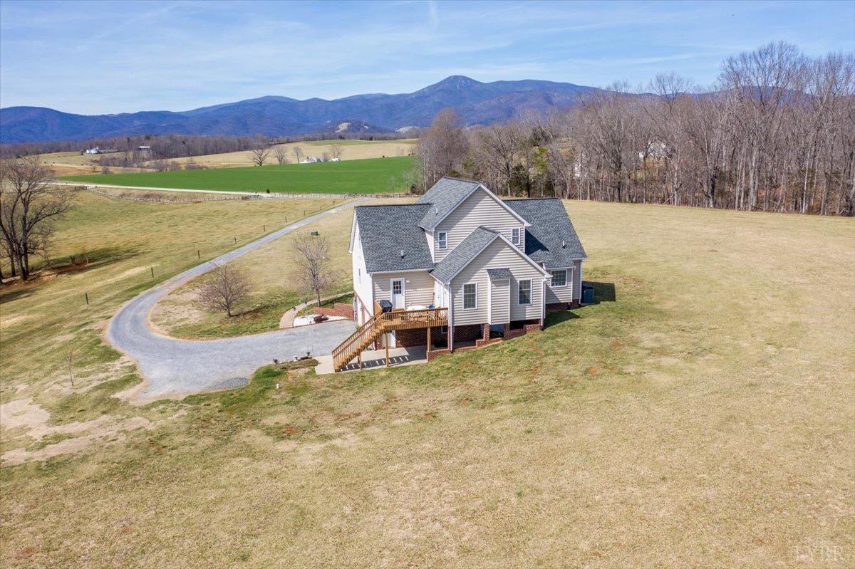 1158 Lowesville Road Amherst, VA 24521 - Photo 3 of 48 a view of a house with a yard and a large tree