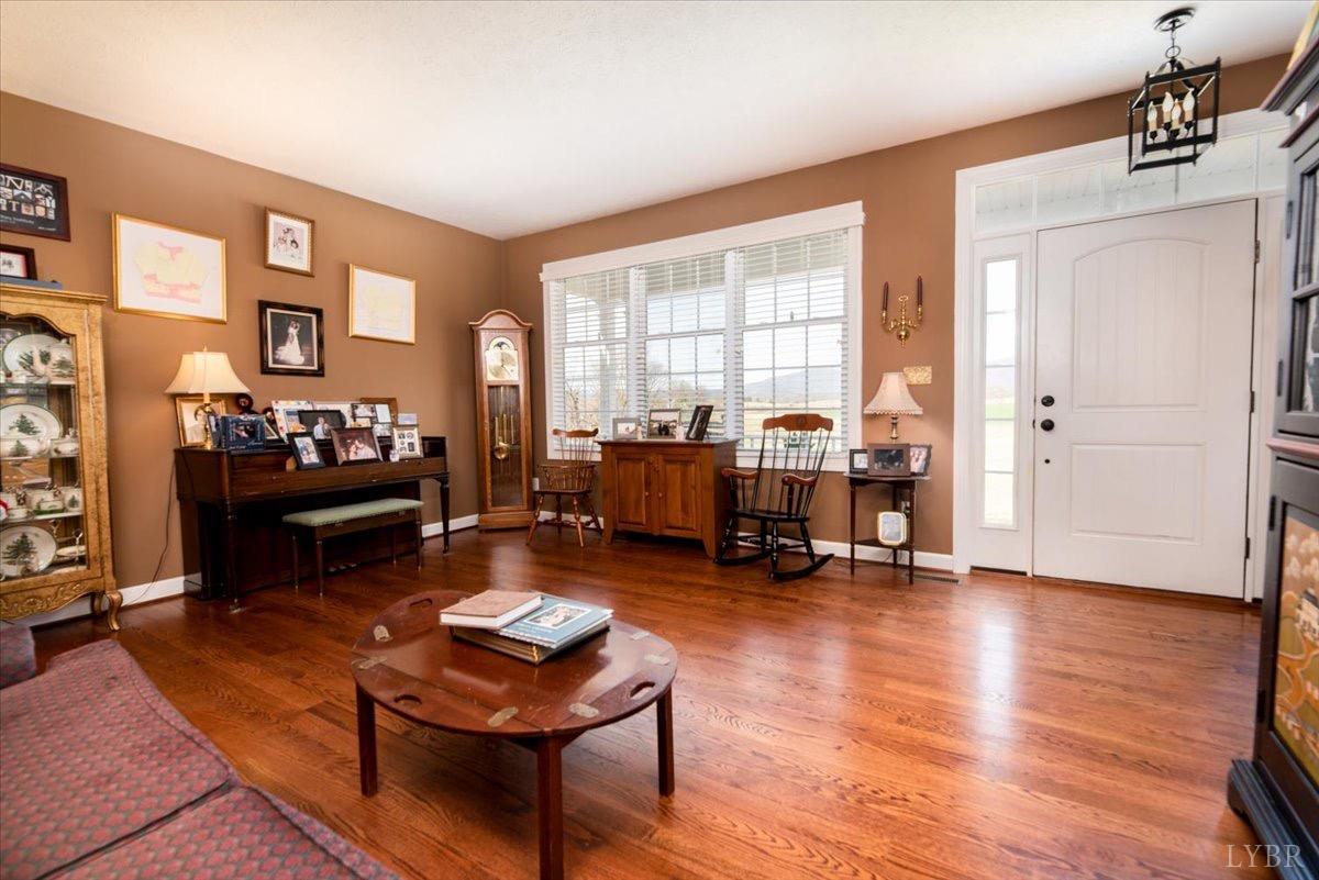 1158 Lowesville Road Amherst, VA 24521 - Photo 9 of 48 a living room with furniture and a wooden floor