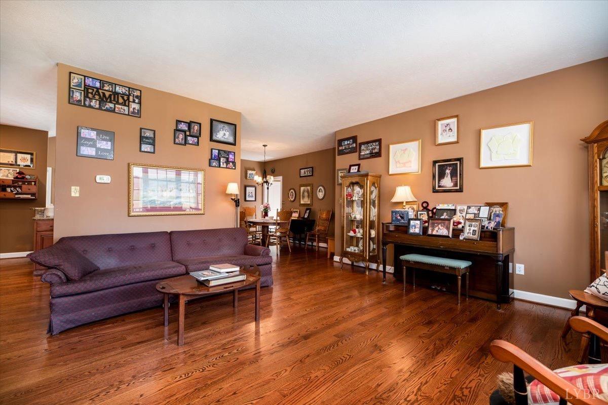 1158 Lowesville Road Amherst, VA 24521 - Photo 10 of 48 a living room with furniture and wooden floor