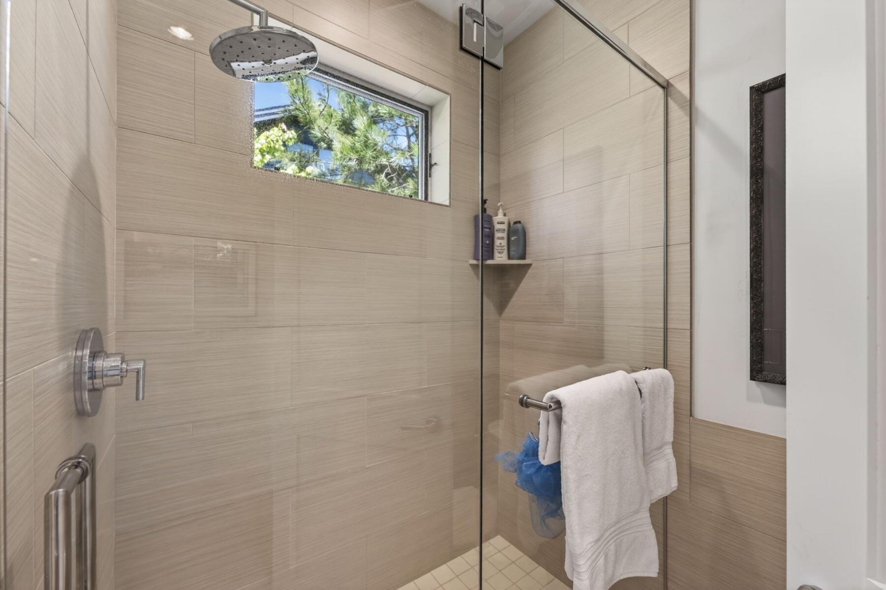 61487 Hackleman Court Bend, OR 97702 - Photo 30 of 35 a bathroom with a bathtub and shower