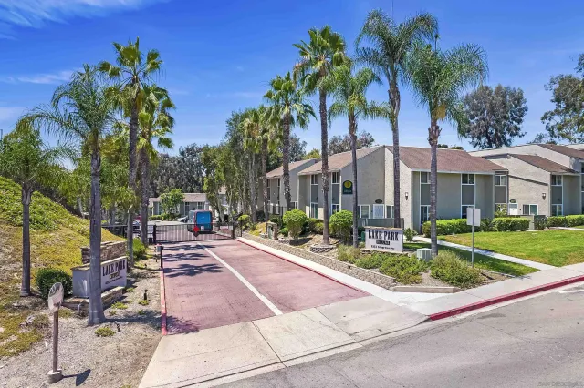 a front view of multiple houses with yard