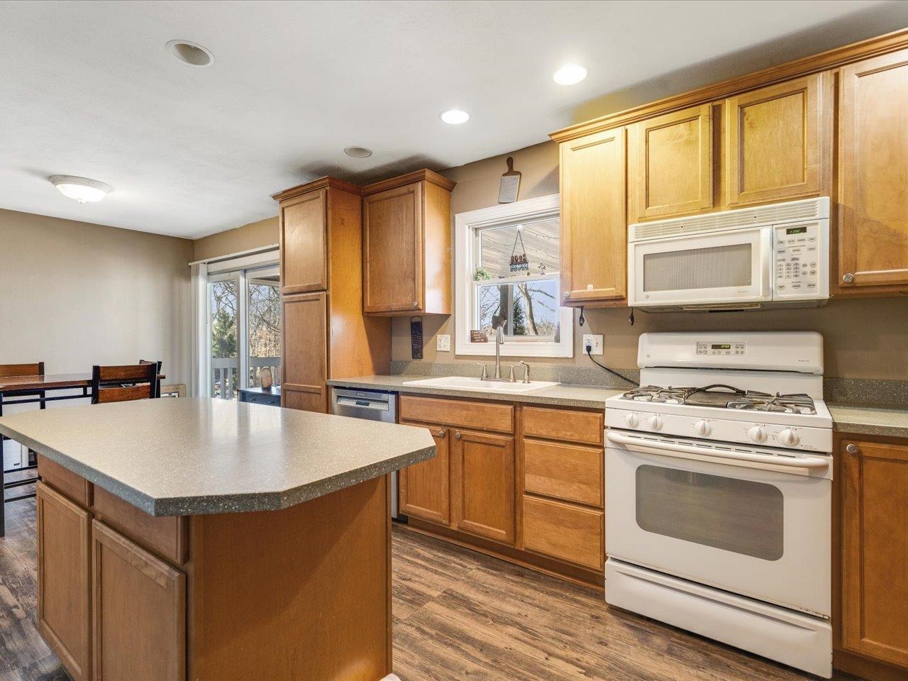 585 Knollwood Road Lake Summerset, IL 61019 - Photo 1 of 33 a kitchen with a stove a sink and a refrigerator