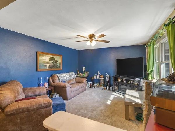 a room with furniture and wooden floor