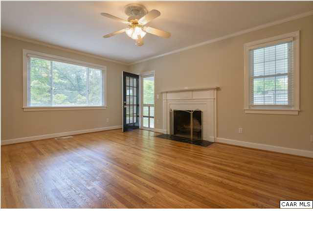 1811 Barracks Road Charlottesville, VA 22903 - Photo 3 of 15 inviting living room with woodburning fireplace extends into a screened porch