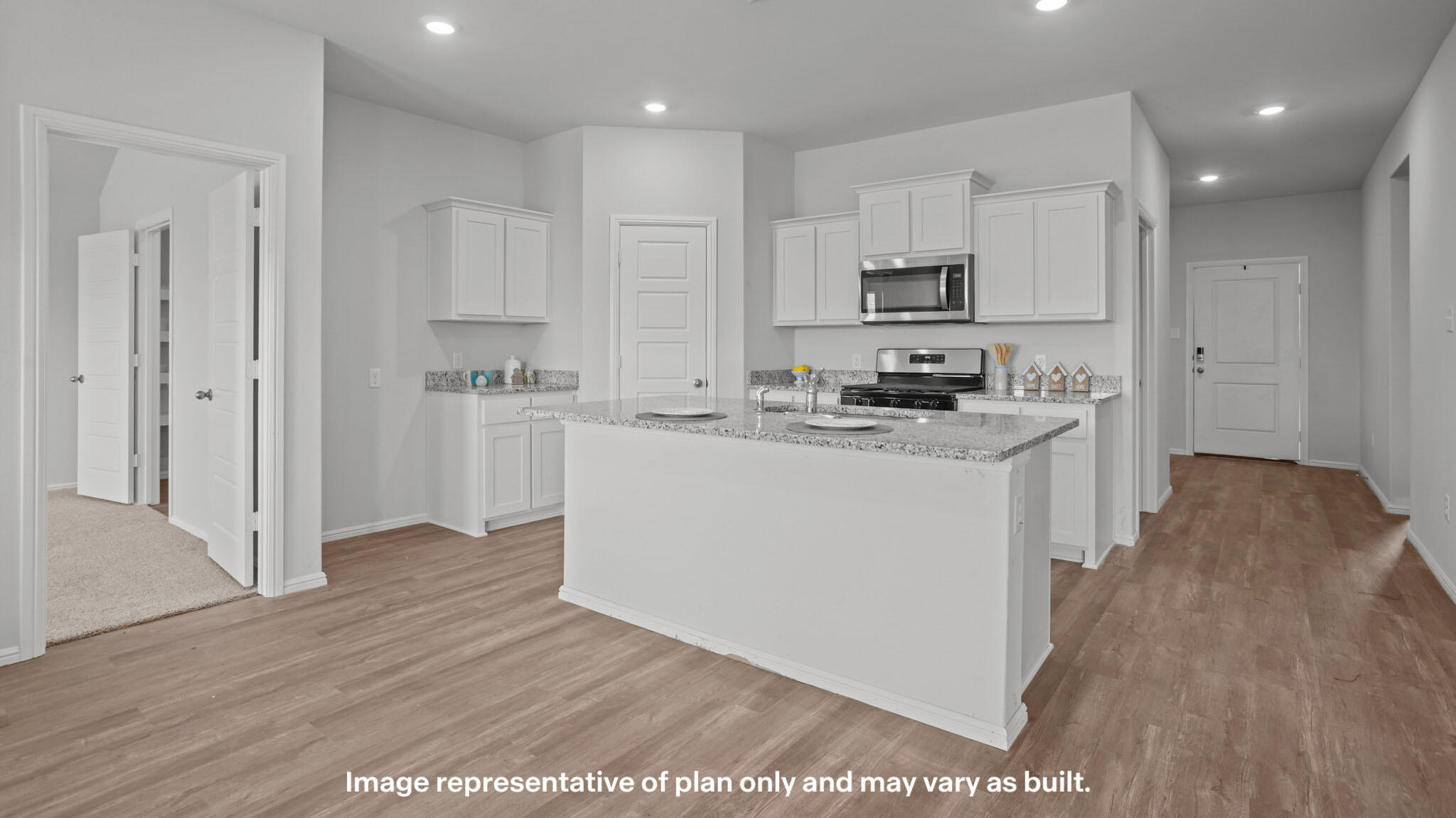 2316 150th Place Lubbock, TX 79423 - Photo 4 of 22 a kitchen with stainless steel appliances a sink a stove a refrigerator cabinets and a wooden floor