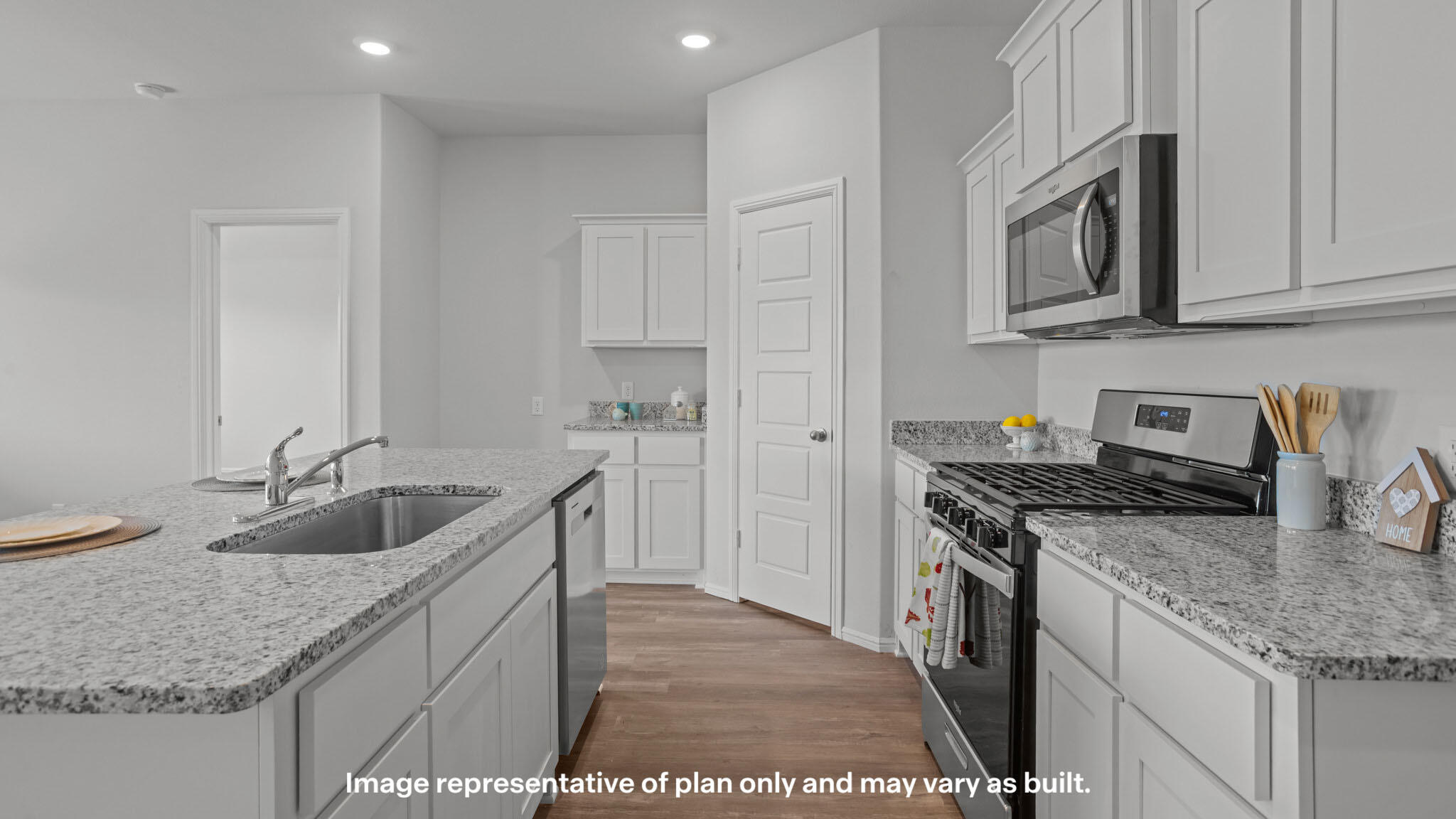 2316 150th Place Lubbock, TX 79423 - Photo 5 of 22 a kitchen with granite countertop a sink and cabinets