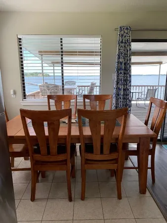 a view of a dining room with furniture window and outside view