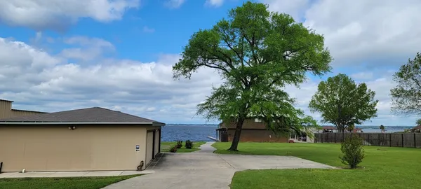 a view of a yard with an outdoor space