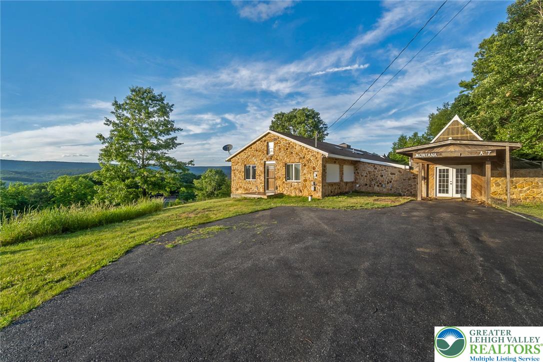 204 Ridge Cup Road New Ringgold, PA 17960 - Photo 5 of 72 Natural stone facade home with panoramic mountain views and a spacious driveway.