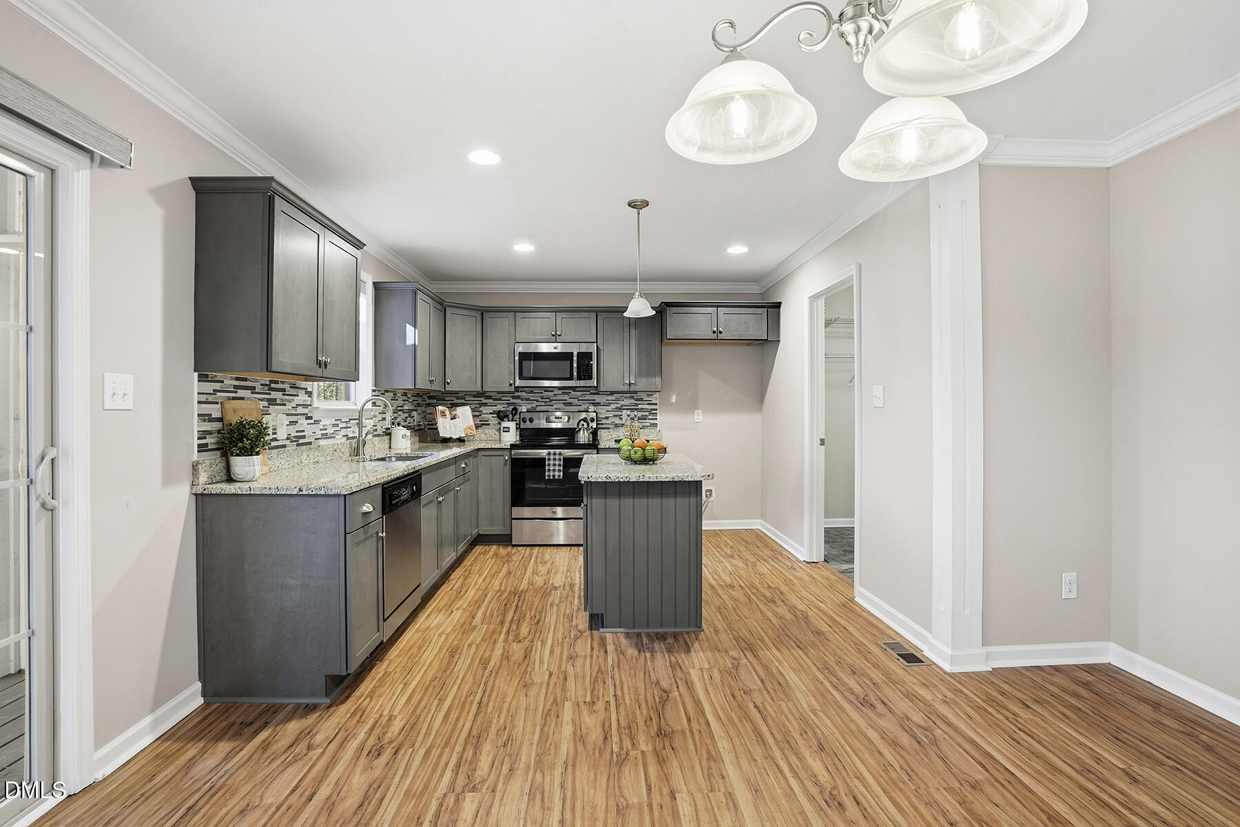 240 North Ridge Drive Louisburg, NC 27549 - Photo 10 of 31 a kitchen with a refrigerator cabinets and wooden floor