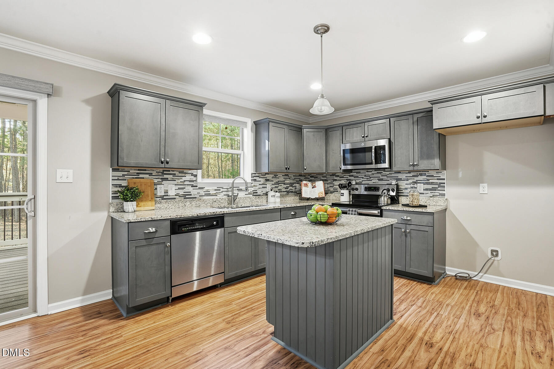 240 North Ridge Drive Louisburg, NC 27549 - Photo 11 of 31 a kitchen with stainless steel appliances granite countertop wooden cabinets a sink dishwasher a stove and a refrigerator