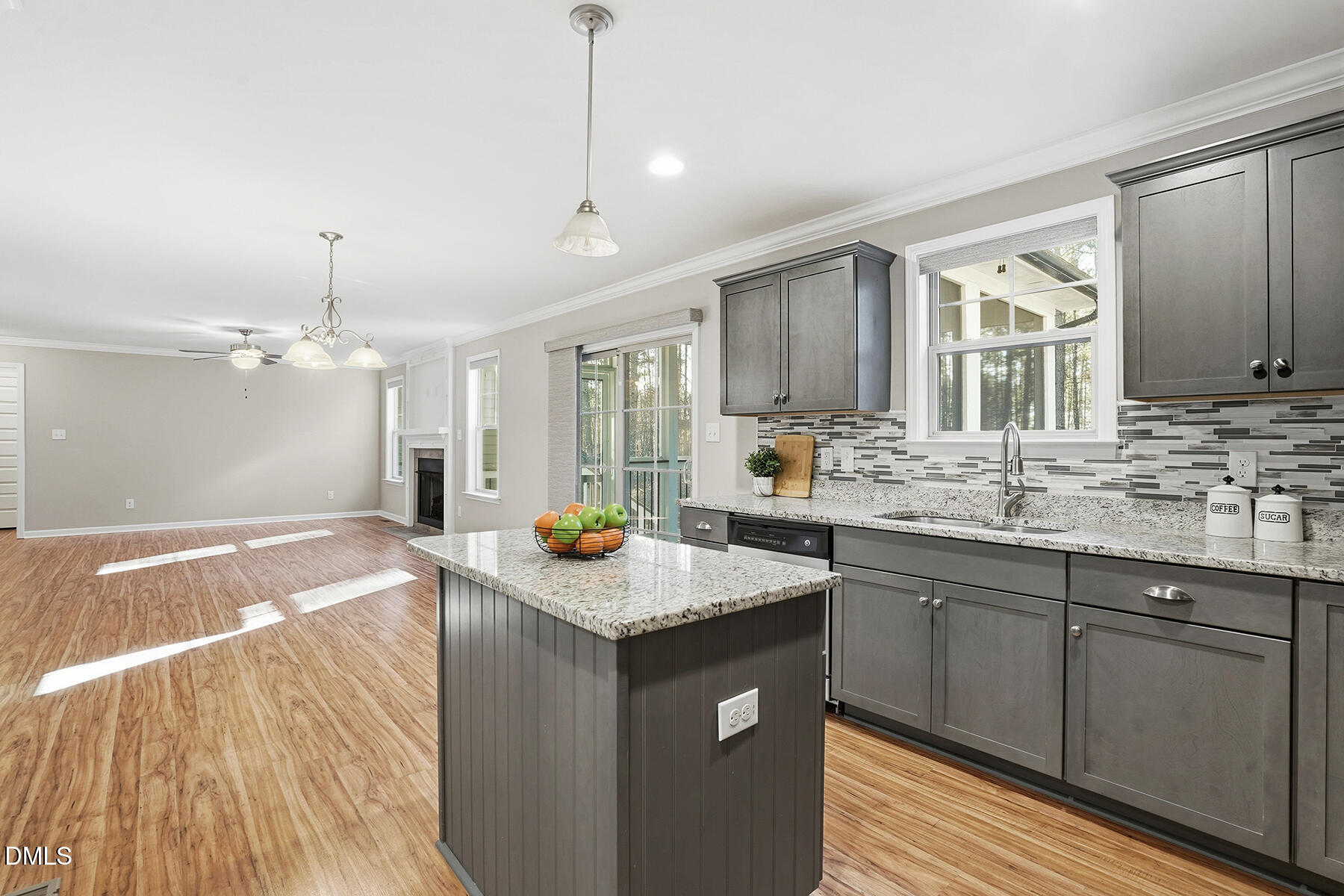 240 North Ridge Drive Louisburg, NC 27549 - Photo 14 of 31 a kitchen with a sink a counter space and wooden floor