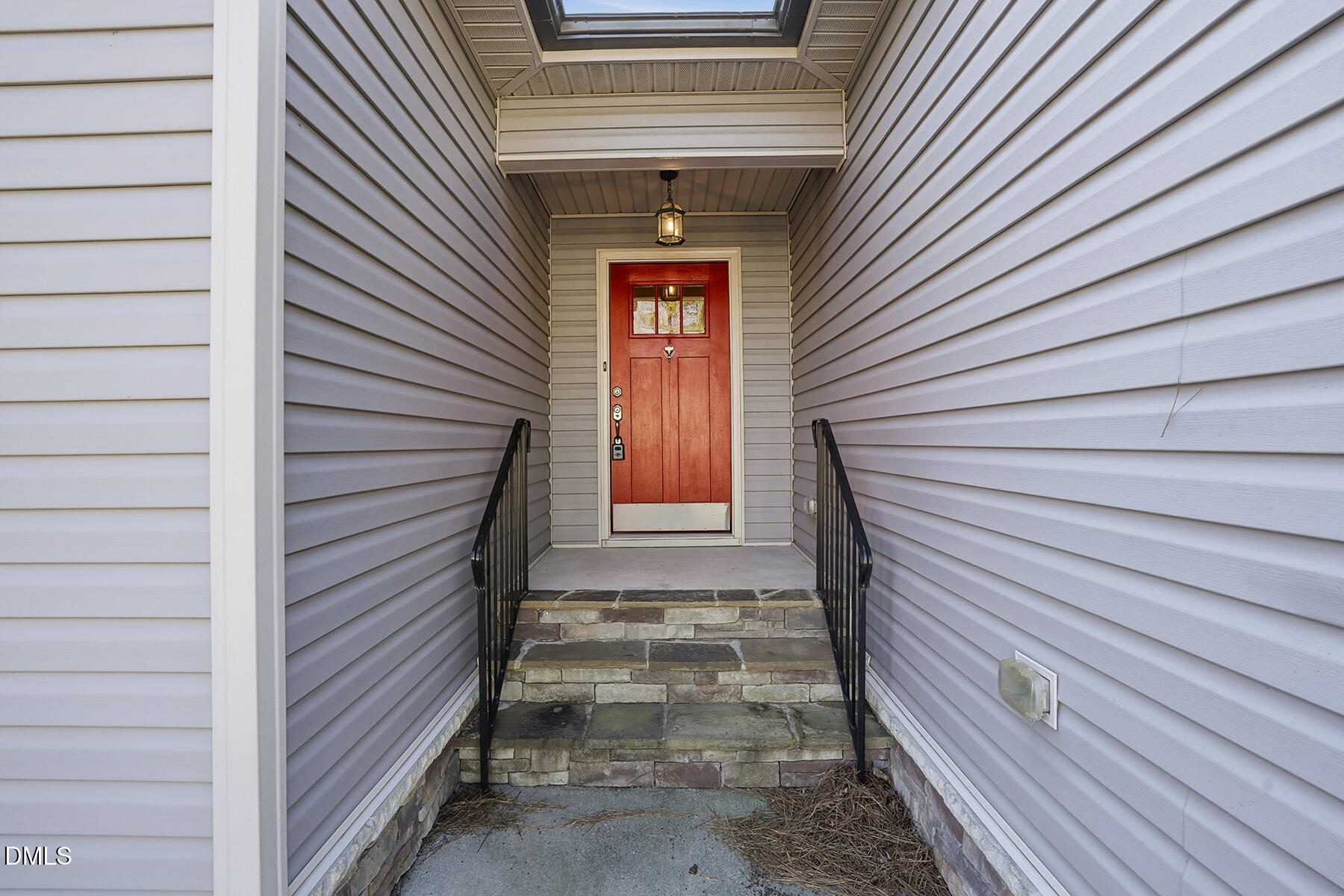 240 North Ridge Drive Louisburg, NC 27549 - Photo 4 of 31 a view of front door of a house with stairs