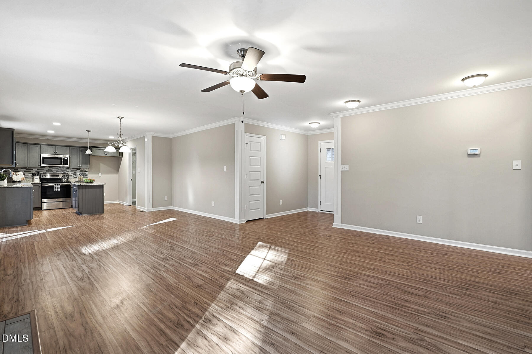 240 North Ridge Drive Louisburg, NC 27549 - Photo 7 of 31 a view of empty room with wooden floor and window