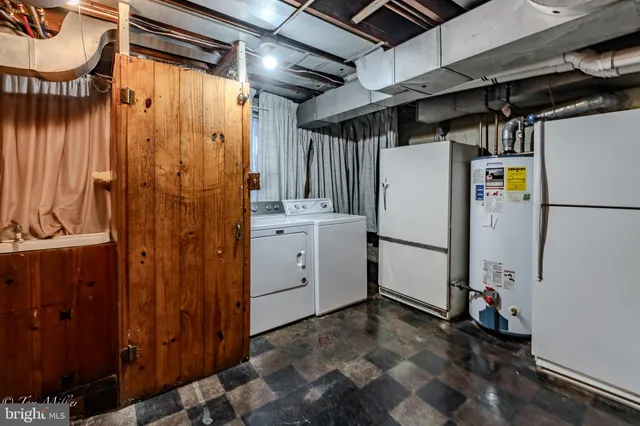 a view of storage and utility room with washer and dryer