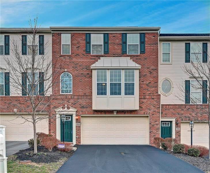 a front view of a house with parking area