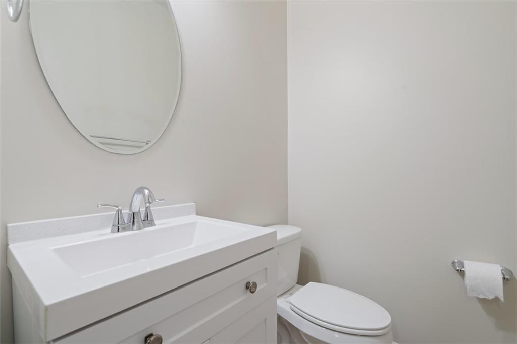 113 Maple Ridge Court Canonsburg, PA 15317 - Photo 7 of 27 a bathroom with a sink a toilet and mirror
