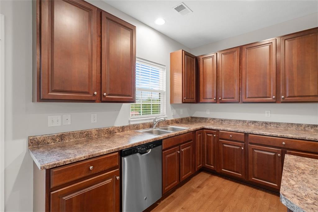 113 Maple Ridge Court Canonsburg, PA 15317 - Photo 10 of 27 a kitchen with stainless steel appliances granite countertop wooden cabinets a sink and dishwasher