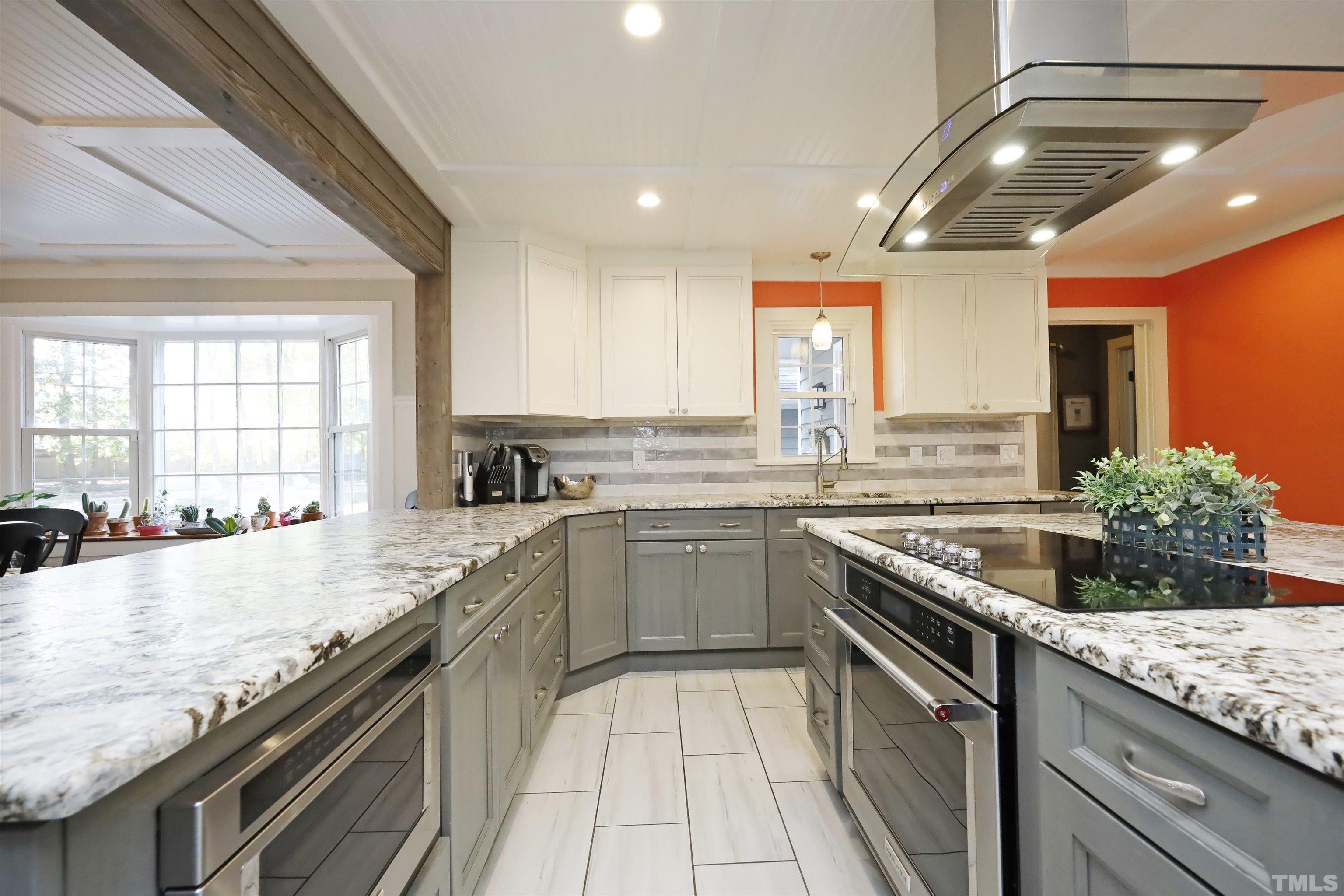 5308 Country Trail Raleigh, NC 27613 - Photo 14 of 51 a kitchen with stainless steel appliances granite countertop sink stove and cabinets