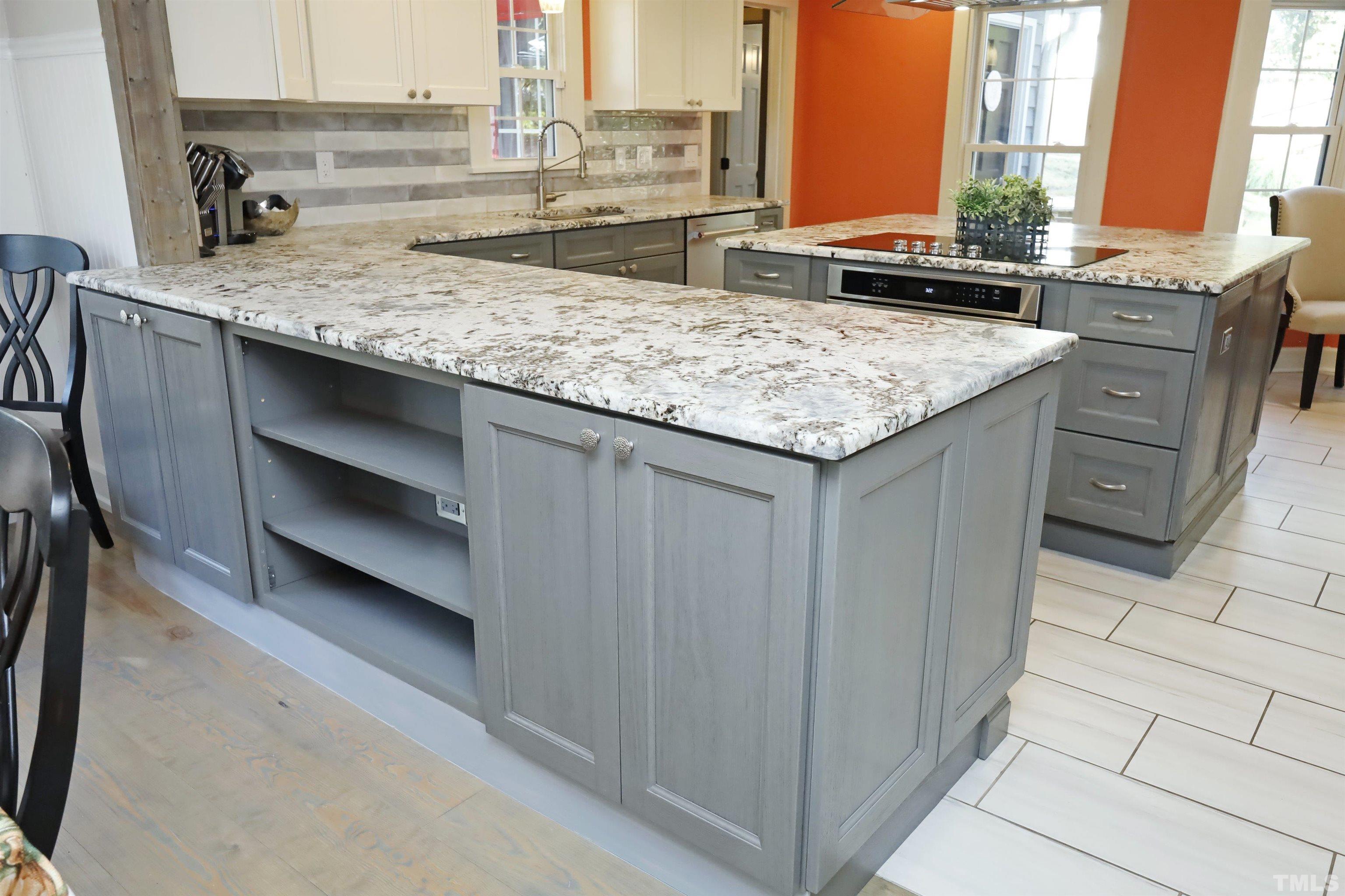 5308 Country Trail Raleigh, NC 27613 - Photo 16 of 51 a view of a kitchen counter top oven and cabinets