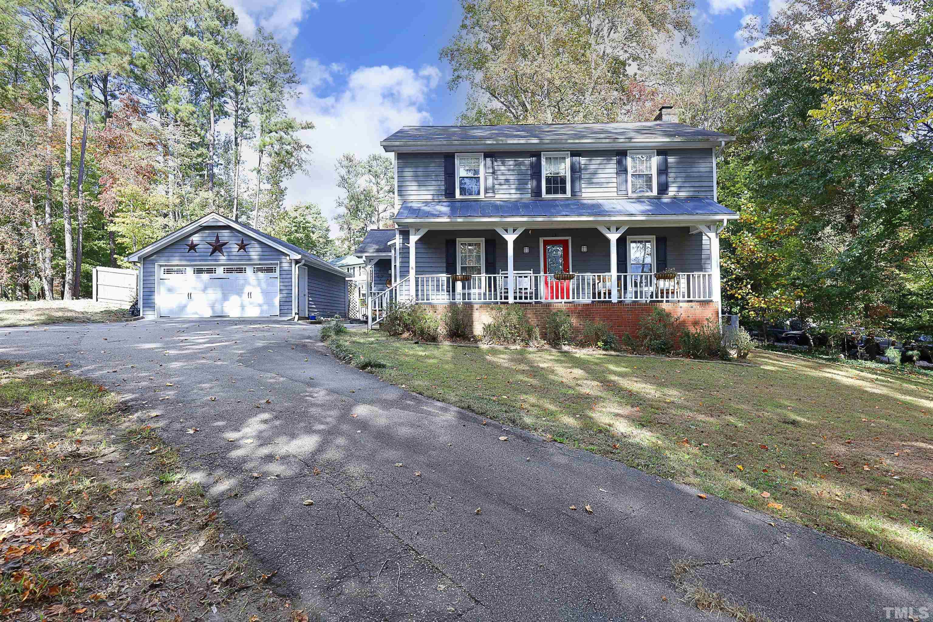 5308 Country Trail Raleigh, NC 27613 - Photo 2 of 51 a front view of a house with a garden