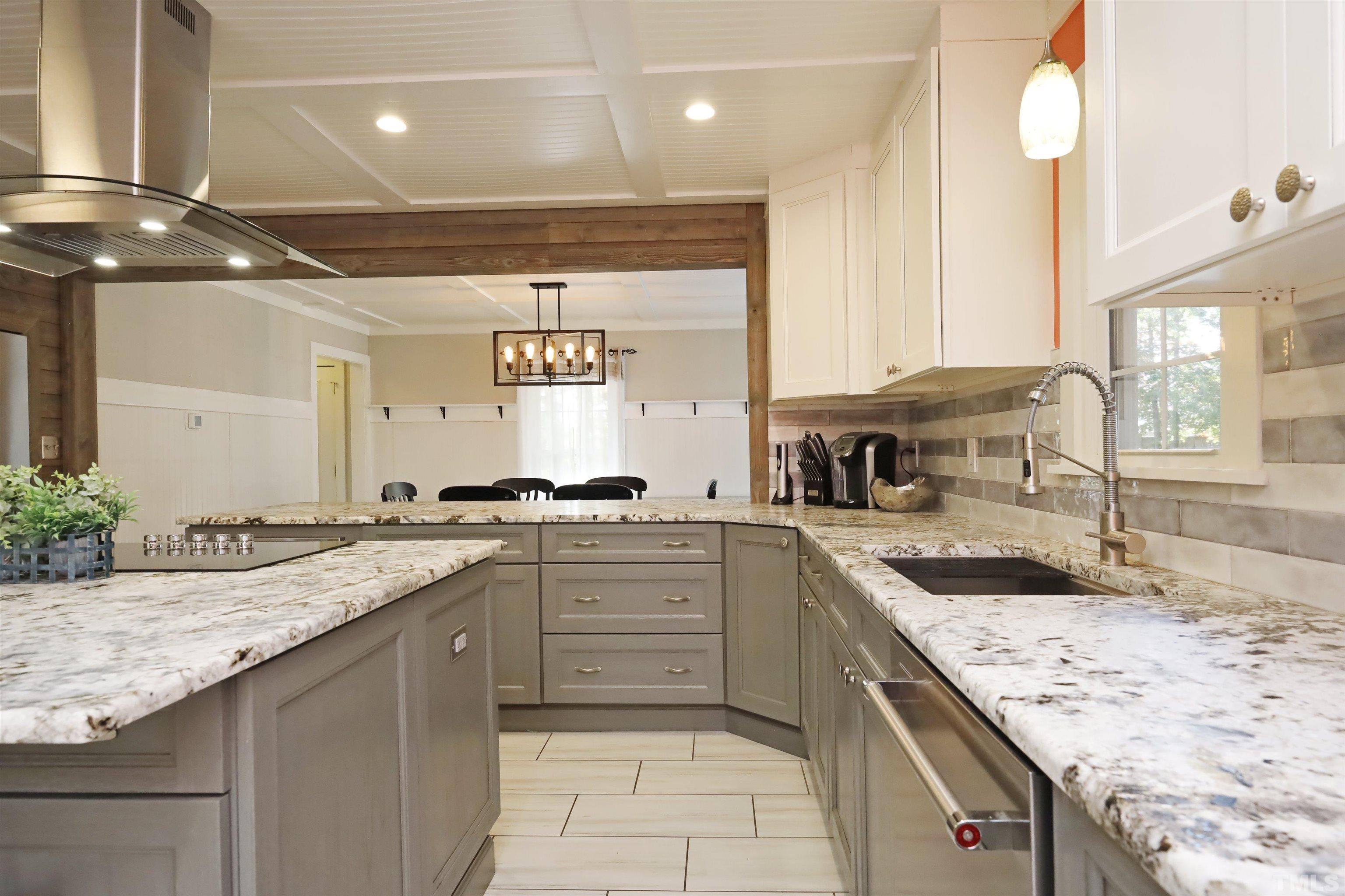 5308 Country Trail Raleigh, NC 27613 - Photo 24 of 51 a kitchen with a sink stove and cabinets