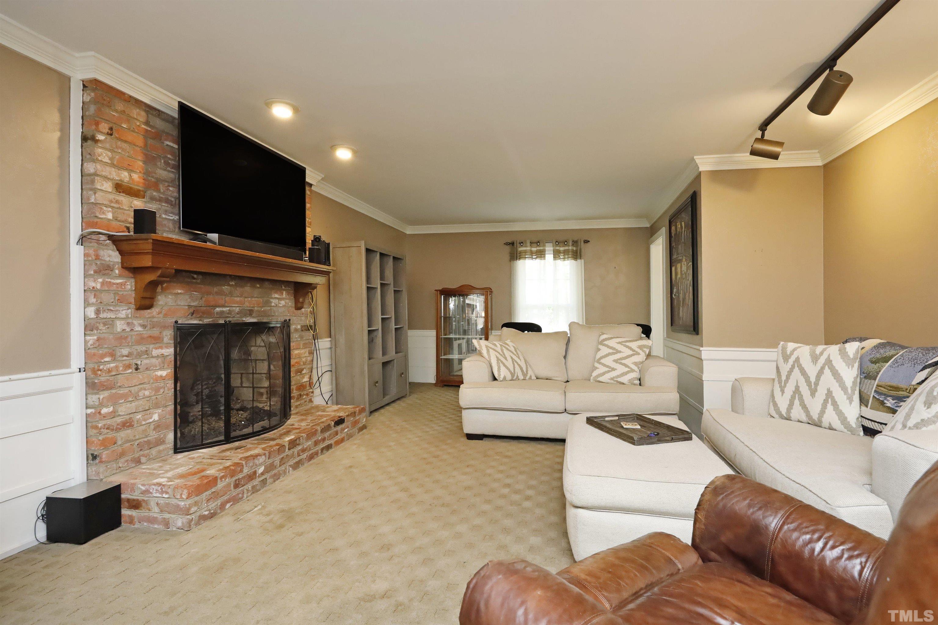 5308 Country Trail Raleigh, NC 27613 - Photo 25 of 51 a living room with furniture and a flat screen tv