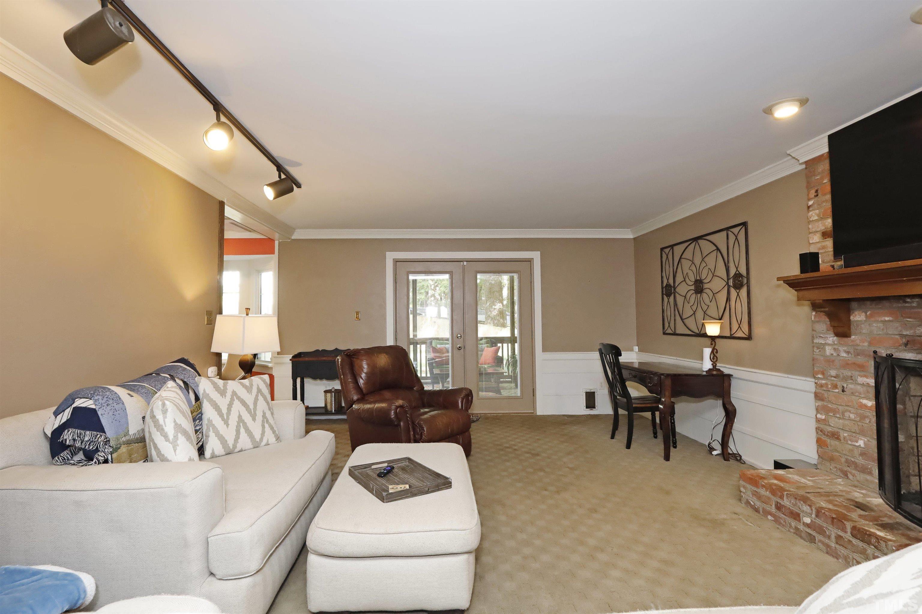 5308 Country Trail Raleigh, NC 27613 - Photo 26 of 51 a living room with furniture and a flat screen tv