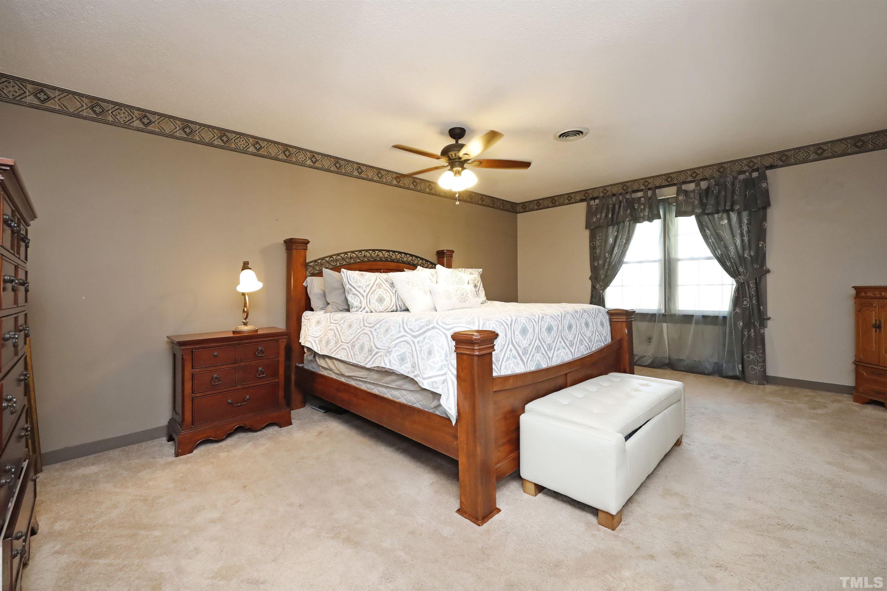 5308 Country Trail Raleigh, NC 27613 - Photo 30 of 51 a bedroom with bed and window