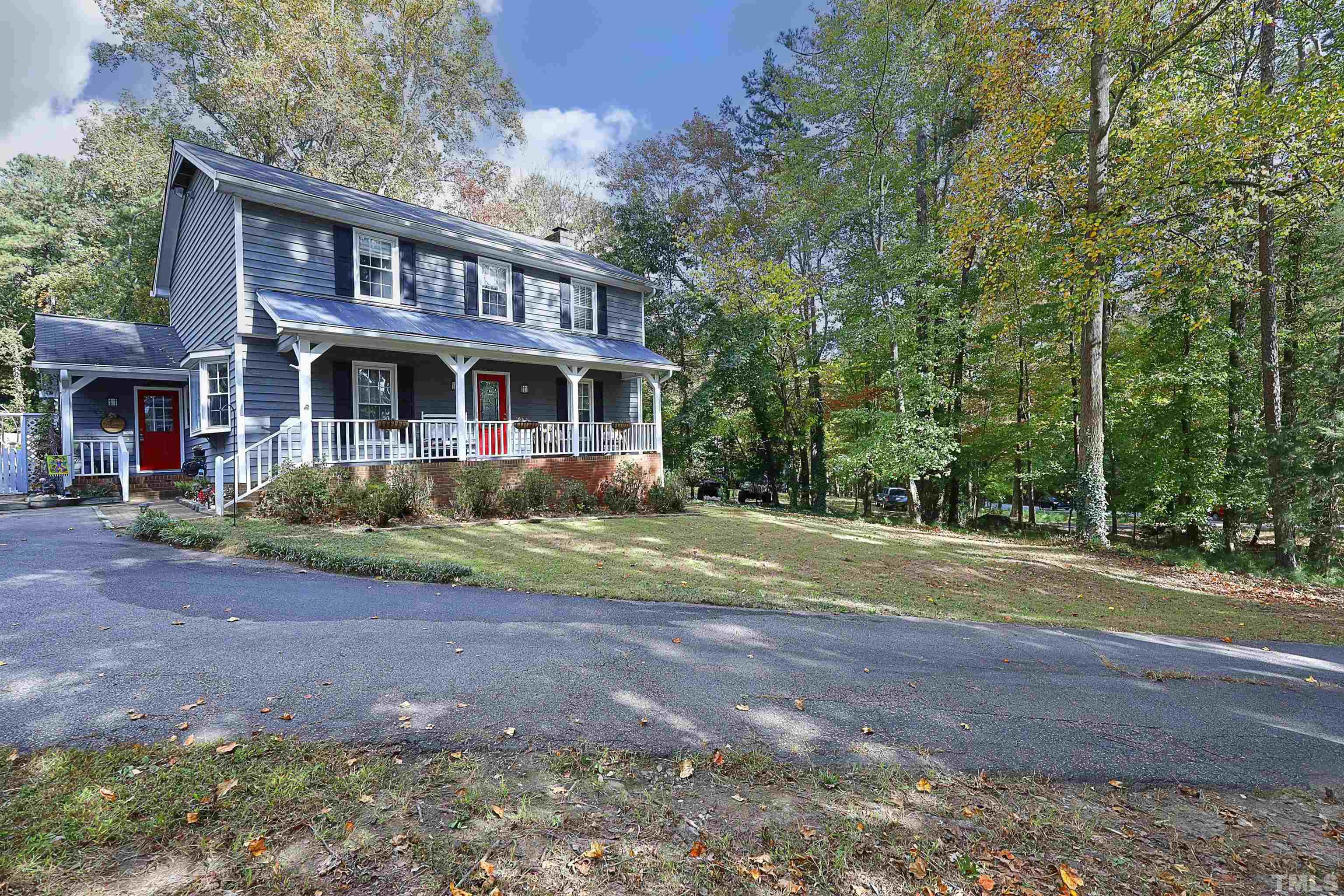5308 Country Trail Raleigh, NC 27613 - Photo 3 of 51 a front view of a house with a yard and trees
