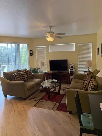 a living room with furniture fireplace and a fireplace
