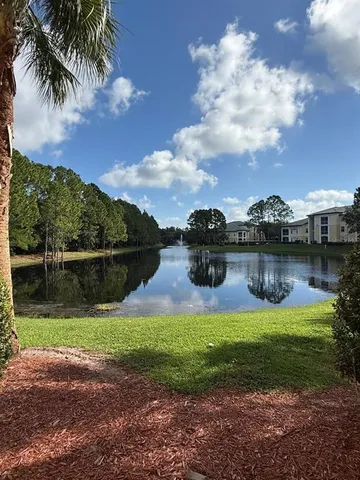 a view of a lake with a big yard